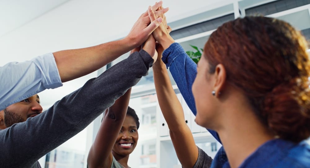 Business people, high five and group for success in office, team building and success for goals. Staff, company win and gesture for victory or deal, celebration and unity or collaboration at workshop